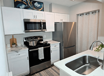 The palms of clearwater apartments fully equipped kitchen (virtually staged